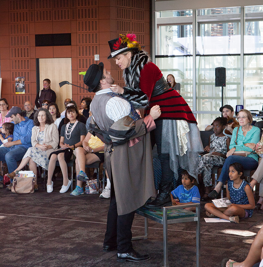 (from left) Jake Millgard as Lucio and Lisel Gorell-Getz as Mistress Overdone performing for the audience from the San Diego Public Library, Central Branch. The 2016 production of The Old Globe's touring program Globe for All, Shakespeare's Measure for Measure, directed by Patricia McGregor, tours community venues Nov. 1 - 20. Photo by Jim Cox. 