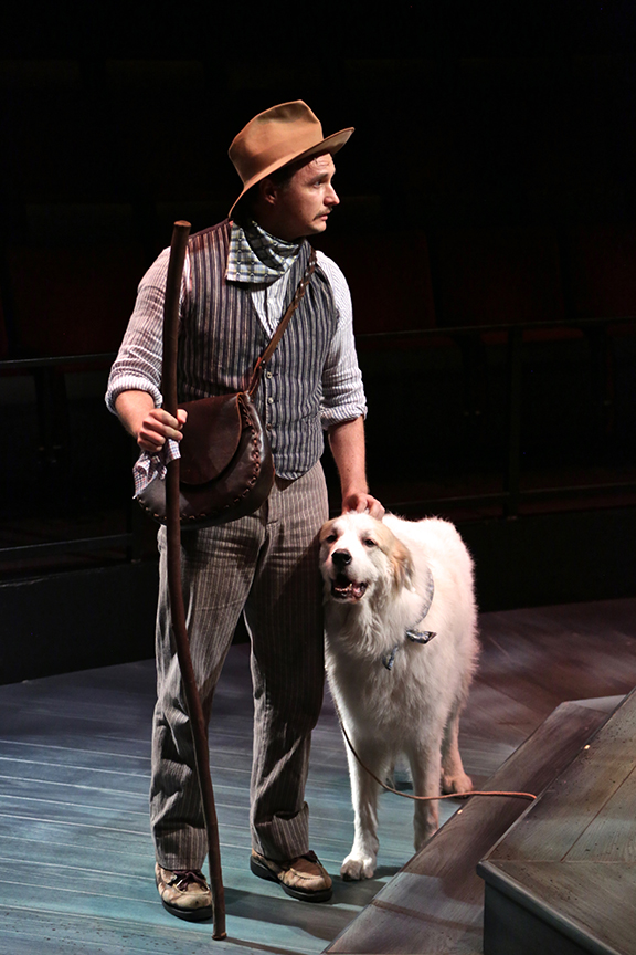 Lorenzo Landini as Launce and Samson as Crab the Dog in The Old Globe and University of San Diego Shiley Graduate Theatre Program production of William Shakespeare's The Two Gentlemen of Verona, directed by Richard Seer, November 12 - 20, 2016. Photo by Adriana Zuniga Photography.