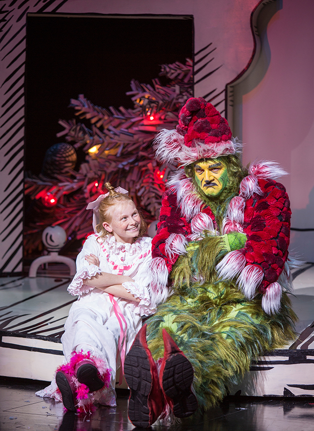 Reese McCulloch appears as Cindy-Lou Who and Edward Watts as The Grinch in Dr. Seuss's How the Grinch Stole Christmas!, book and lyrics by Timothy Mason, music by Mel Marvin, original production conceived and directed by Jack O'Brien, original choreography by John DeLuca, and directed by James Vásquez, running November 4 – December 24, 2017 at The Old Globe. Photo by Jim Cox.