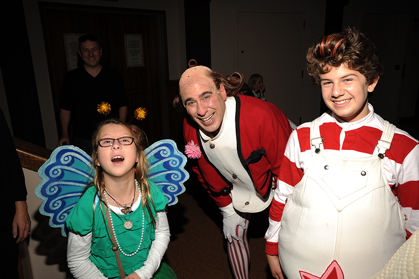 Audience member Daisy Wright and cast members David Kirk Grant and Dylan Nalbandian following the 2014 sensory-friendly performance of Dr. Seuss's How the Grinch Stole Christmas!, book and lyrics by Timothy Mason, music by Mel Marvin, original production conceived and directed by Jack O'Brien, original choreography by John DeLuca, and directed by James Vásquez, at The Old Globe. Photo by Douglas Gates.