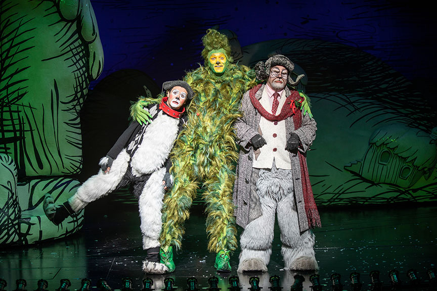 Tommy Martinez as Young Max, Edward Watts as The Grinch, and John Treacy Egan as Old Max. Dr. Seuss's How the Grinch Stole Christmas!, book and lyrics by Timothy Mason, music by Mel Marvin, original production conceived and directed by Jack O'Brien, original choreography by John DeLuca, and directed by James Vásquez, running November 10 – December 29, 2019 at The Old Globe. Photo by Jim Cox.