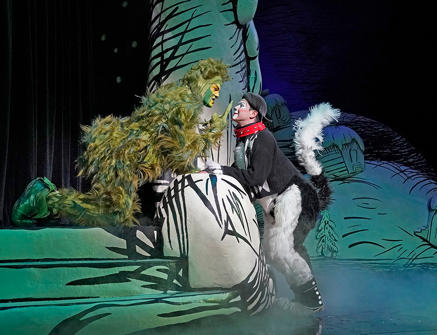 (from left) Edward Watts appears as The Grinch and Tommy Martinez as Young Max in Dr. Seuss's How the Grinch Stole Christmas!, book and lyrics by Timothy Mason, music by Mel Marvin, original production conceived and directed by Jack O'Brien, original choreography by John DeLuca, and directed by James Vásquez, running November 3 – December 29, 2018 at The Old Globe. Photo by Ken Howard.