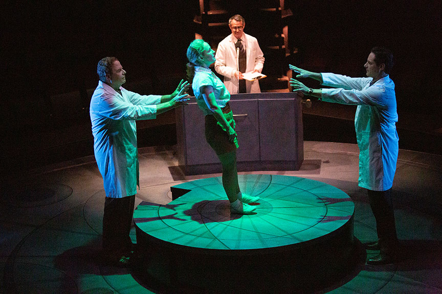 Michael Pemberton as Lab Tech, Morgan Hallett as Jerrie Cobb, Matthew Boston as Dr. Randy Lovelace, and Peter Rini as Lab Tech in They Promised Her the Moon, running April 6 – May 12, 2019 at The Old Globe. Photo by Jim Cox.