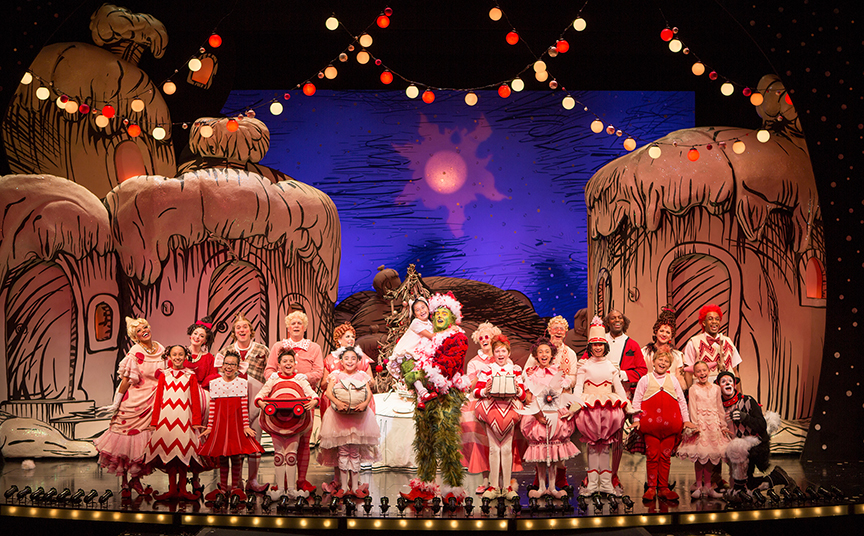 Abigail Estrella appears as Cindy-Lou Who (center) with the cast of Dr. Seuss's How the Grinch Stole Christmas!, book and lyrics by Timothy Mason, music by Mel Marvin, original production conceived and directed by Jack O'Brien, original choreography by John DeLuca, and directed by James Vásquez, running November 4 – December 24, 2017 at The Old Globe. Photo by Jim Cox.