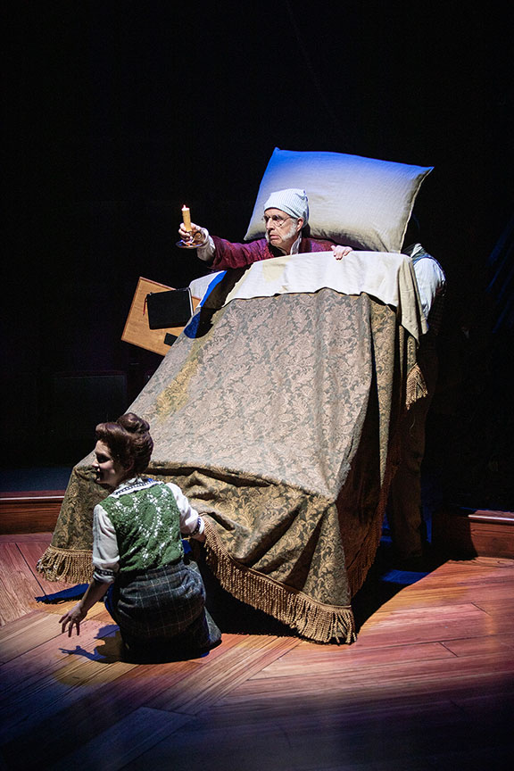 Cathryn Wake with Robert Joy as Ebenezer Scrooge. Ebenezer Scrooge's BIG San Diego Christmas Show runs November 23 – December 29, 2019 at The Old Globe. Photo by Jim Cox.