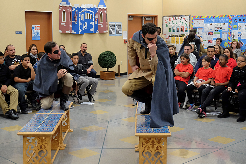 (from left) Tyler Kent as Conrade and Lowell Byers as Don John performing for the audience from South Bay Community Services at Castle Park Elementary School. The 2015 production of The Old Globe's touring program Globe for All, Shakespeare's Much Ado About Nothing, directed by Rob Melrose, tours community venues Nov. 10 - 22. Photo by Ken Jacques. 