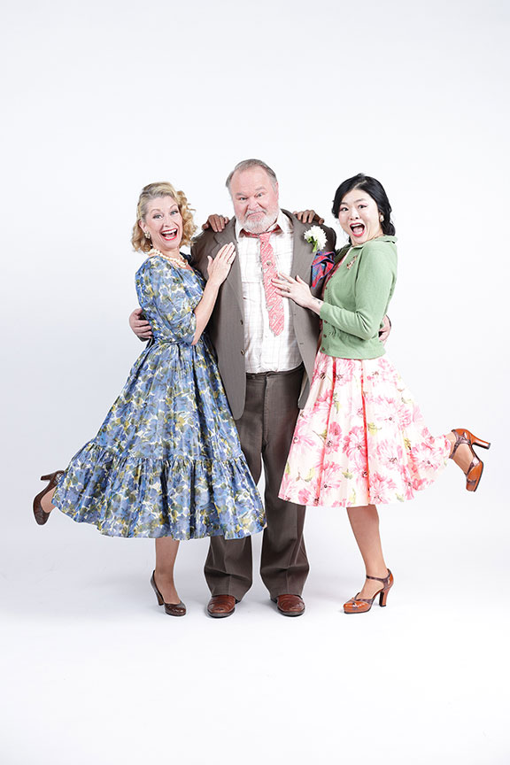 (from left) Angela Pierce as Mrs. Ford, Tom McGowan as Falstaff, and Ruibo Qian as Mrs. Page in The Old Globe’s production of Shakespeare’s The Merry Wives of Windsor, 2023. Photo by Rich Soublet II.