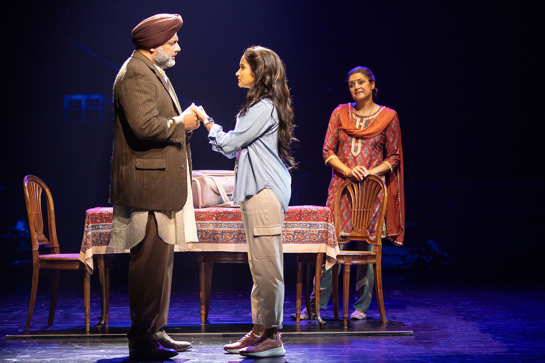  (from left) Irvine Iqbal as Baldev, Shoba Narayan as Simran, and Rupal Pujara as Lajjo in Come Fall in Love – The DDLJ Musical, 2022. Photo by Jim Cox.