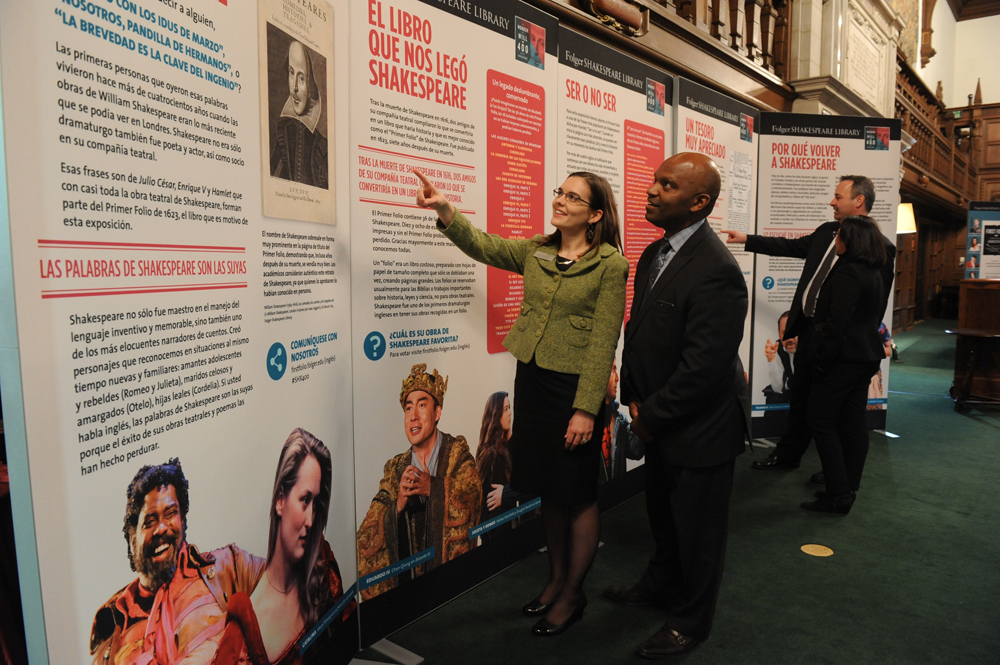 Guests take in the First Folio display at the Folger Shakespeare Library in Washington, D.C.  Photo by Lloyd Wolf.