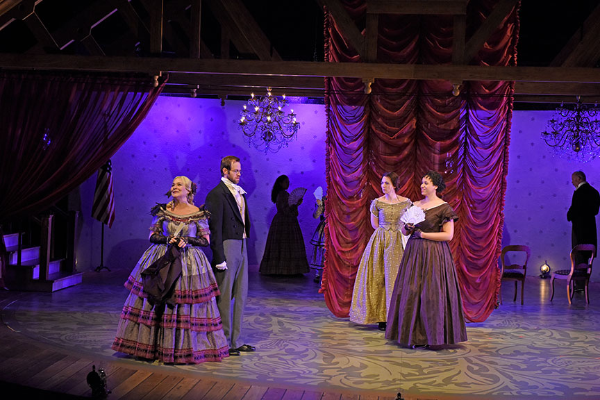 (from left) Sally Nystuen Vahle as Aunt March, Alex Organ as John Brooks, Pearl Rhein as Jo March, and Jennie Greenberry as Meg March. The West Coast premiere of Little Women by Kate Hamill, directed by Sarah Rasmussen, presented in association with Dallas Theater Center, runs March 14 – April 19, 2020 at The Old Globe. Photo by Karen Almond.