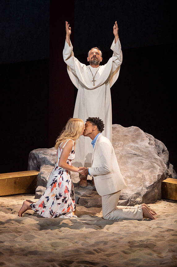 Jesse J. Perez as Friar Lawrence, with Louisa Jacobson as Juliet, and Aaron Clifton Moten as Romeo. Romeo and Juliet, by William Shakespeare and directed by Barry Edelstein, runs August 11 – September 15, 2019 at The Old Globe. Photo by Jim Cox.