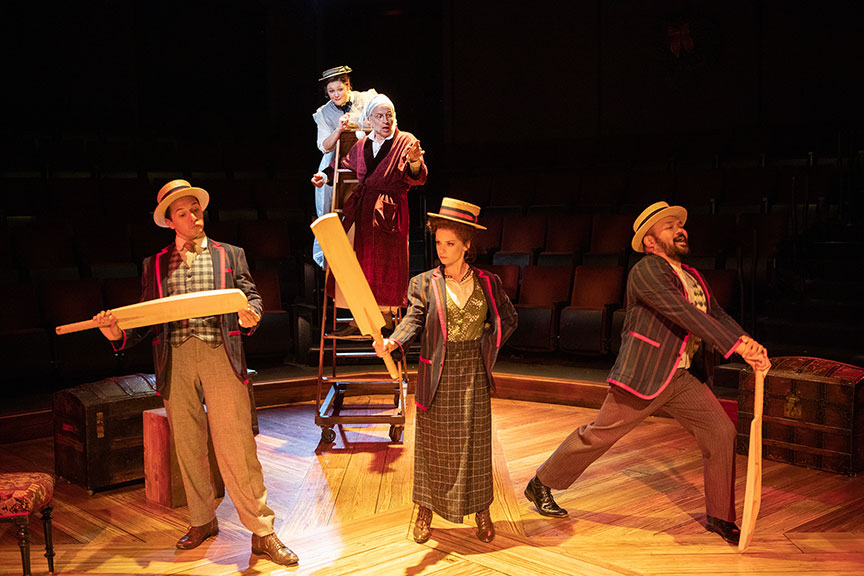 Dan Rosales as Young Scrooge, Jacque Wilke as Ghost of Christmas Past, Robert Joy as Ebenezer Scrooge, Cathryn Wake as Archibald, and Orville Mendoza as Charles. Ebenezer Scrooge's BIG San Diego Christmas Show runs November 23 – December 29, 2019 at The Old Globe. Photo by Jim Cox.