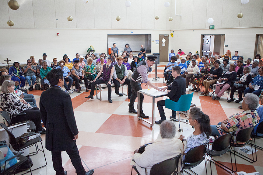 (from left) Flordelino Lagundino as Escalus, Ally Carey as Pompey, Jake Millgard as Froth, Christopher Salazar as Elbow, and Daniel Petzold as Angelo performing for the audience from Fourth District Senior Resource Center at George Stevens Senior Center. The 2016 production of The Old Globe's touring program Globe for All, Shakespeare's Measure for Measure, directed by Patricia McGregor, tours community venues Nov. 1 - 20. Photo by Jim Cox. 