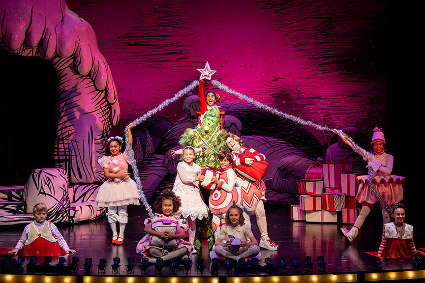 Andrew Polec as The Grinch (center) with the Who ensemble in Dr. Seuss's How the Grinch Stole Christmas!, 2022. Photo by Rich Soublet II.