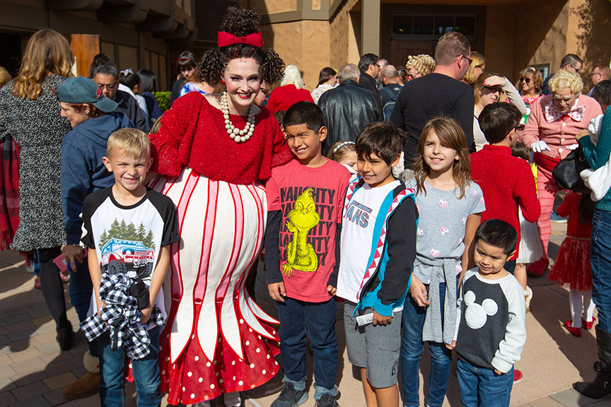 Audience and cast members following the 2018 sensory-friendly performance of Dr. Seuss's How the Grinch Stole Christmas!, book and lyrics by Timothy Mason, music by Mel Marvin, original production conceived and directed by Jack O'Brien, original choreography by John DeLuca, and directed by James Vásquez, at The Old Globe. Photo by Rich Soublet II.