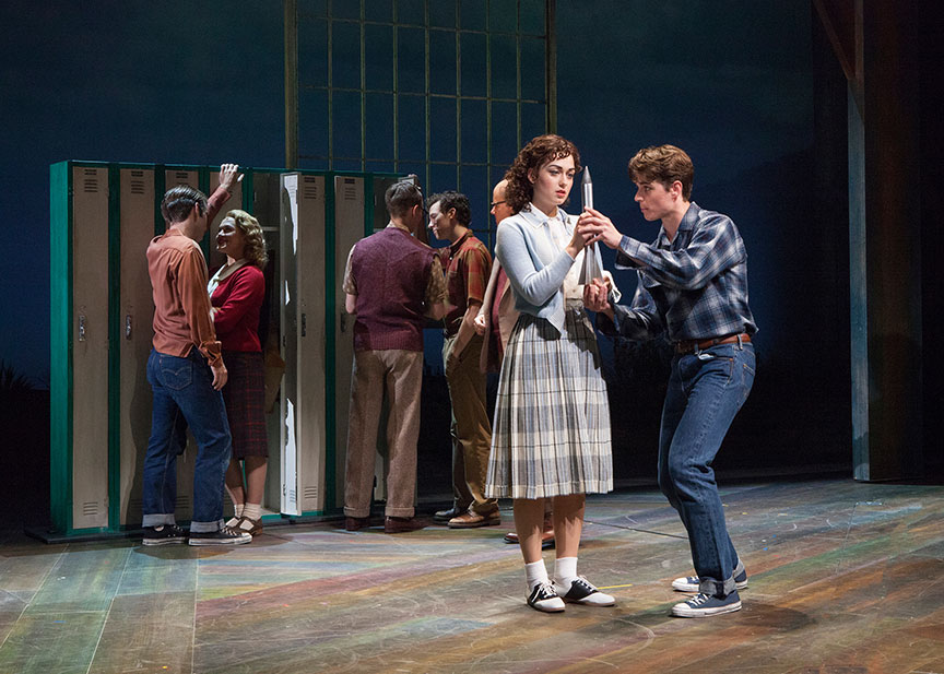 (foreground) Eliza Palasz as Dorothy and Kyle Selig as Homer Hickam with the cast of the West Coast premiere of October Sky, with book by Brian Hill and Aaron Thielen, music and lyrics by Michael Mahler, directed and choreographed by Rachel Rockwell, inspired by the Universal Pictures film and Rocket Boys by Homer H. Hickam, Jr., running Sept. 10 - Oct. 23, 2016 at The Old Globe. Photo by Jim Cox.