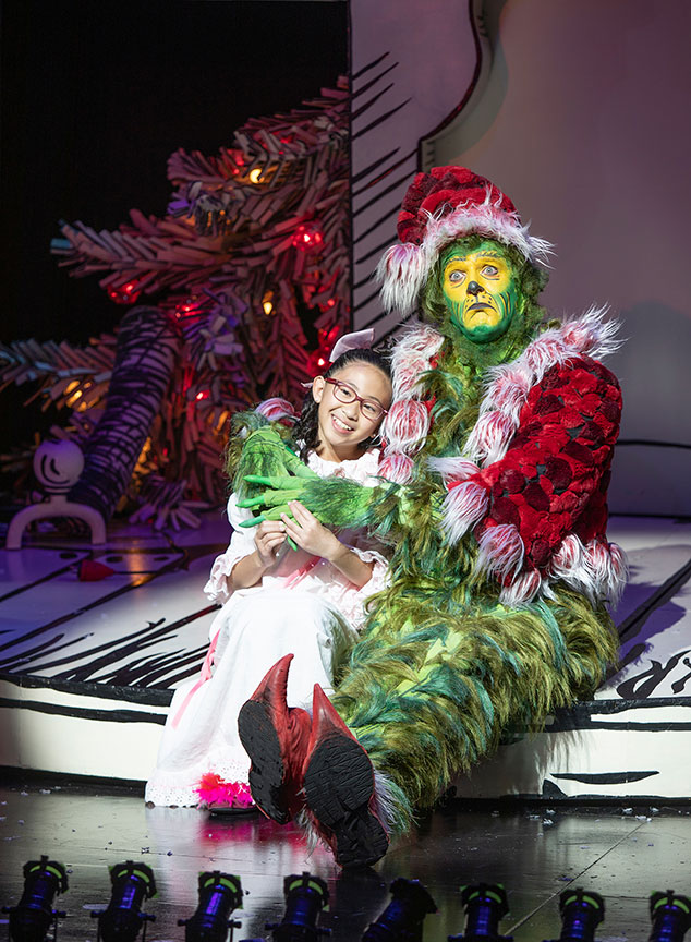 Sophia Adajar as Cindy-Lou Who and Edward Watts as The Grinch. Dr. Seuss's How the Grinch Stole Christmas!, book and lyrics by Timothy Mason, music by Mel Marvin, original production conceived and directed by Jack O'Brien, original choreography by John DeLuca, and directed by James Vásquez, running November 10 – December 29, 2019 at The Old Globe. Photo by Jim Cox.