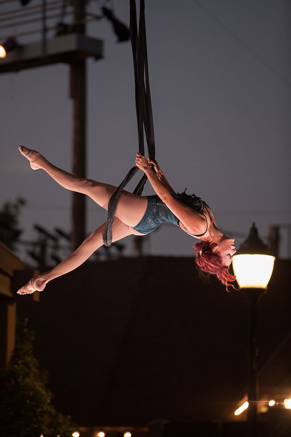Aerialist on The Old Globe's Copley Plaza. Photo by Melissa Jacobs. 