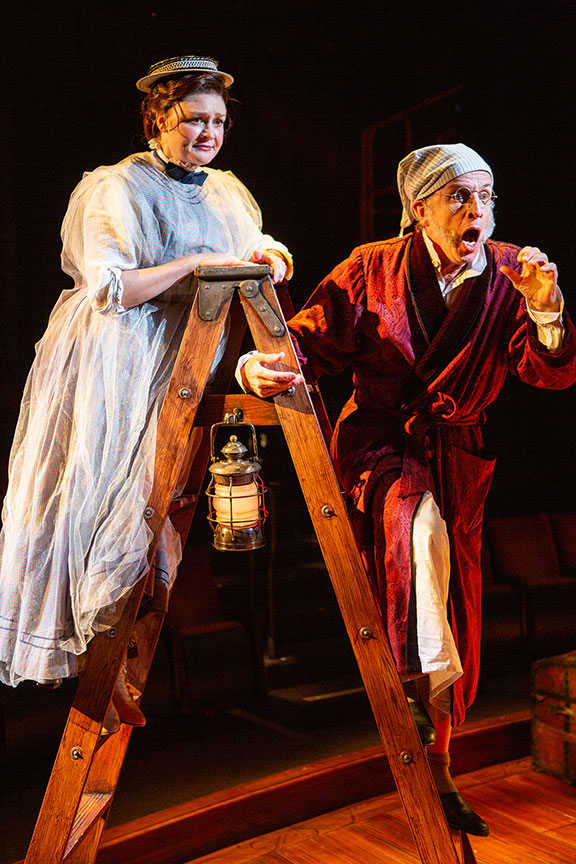 Jacque Wilke as Ghost of Christmas Past and Robert Joy as Ebenezer Scrooge. Ebenezer Scrooge's BIG San Diego Christmas Show runs November 23 – December 29, 2019 at The Old Globe. Photo by Jim Cox.