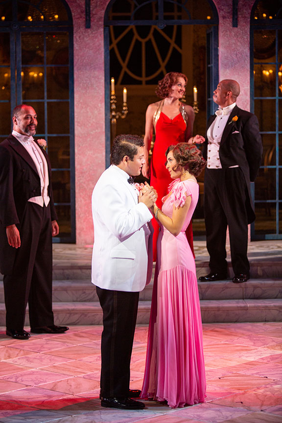 (foreground) Carlos Angel-Barajas as Claudio and Morgan Taylor as Hero with René Thornton Jr. as Leonato, Sara Topham as Beatrice, and Michael Boatman as Don Pedro in Much Ado About Nothing, by William Shakespeare, directed by Kathleen Marshall, runs August 12 – September 16, 2018 at The Old Globe. Photo by Jim Cox.