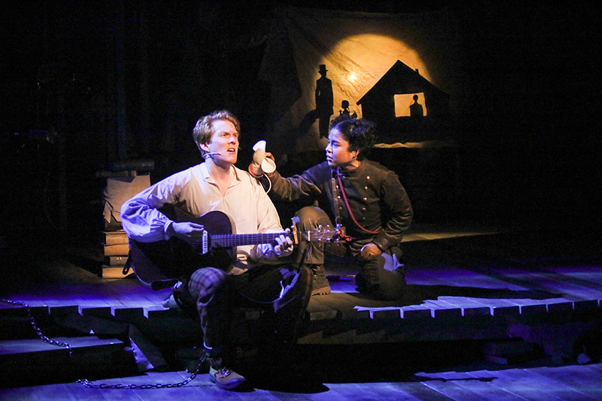 Ryan Melia as Librarian and Bianca Norwood as Despereaux in The Tale of Despereaux, book, music, and lyrics by PigPen Theatre Co., based on the novel by Kate DiCamillo and the Universal Pictures animated film, directed by Marc Bruni and PigPen Theatre Co., running July 6 – August 11, 2019 at The Old Globe. Photo by Jim Cox.